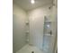 A clean shower stall features built-in shelving, and a modern shower head fixture at 8864 Sw 49Th Cir, Ocala, FL 34476