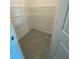 This is a walk in closet with white shelves and tile flooring at 8864 Sw 49Th Cir, Ocala, FL 34476