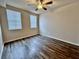 Bright bedroom with wood-look floors and ceiling fan at 911 N Orange Ave # 127, Orlando, FL 32801