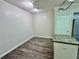 Bright dining area with wood-look floors and neutral walls at 911 N Orange Ave # 127, Orlando, FL 32801