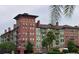 Attractive multi-story building with balconies and palm trees at 911 N Orange Ave # 127, Orlando, FL 32801