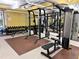Modern gym featuring a power rack, weight bench, and various dumbbells at 911 N Orange Ave # 127, Orlando, FL 32801