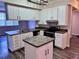 Updated kitchen featuring white cabinets, granite countertops and island at 911 N Orange Ave # 127, Orlando, FL 32801