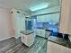 Modern kitchen with white cabinets, granite countertops and island at 911 N Orange Ave # 127, Orlando, FL 32801