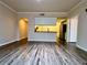 Spacious living room with wood-look floors and kitchen views at 911 N Orange Ave # 127, Orlando, FL 32801