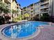 Inviting swimming pool surrounded by a brick patio at 911 N Orange Ave # 127, Orlando, FL 32801
