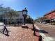 Brick-paved street scene with clock tower and pedestrians at 951 Powhatan Dr, Sanford, FL 32771