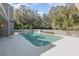 Rectangular swimming pool, surrounded by trees at 951 Powhatan Dr, Sanford, FL 32771