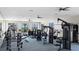 Spacious gym with modern exercise equipment and plenty of natural light at 9741 Petition Way Petition Way, Orlando, FL 32832