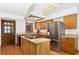 Kitchen with stainless steel appliances and an island at 9877 7Th Ave, Orlando, FL 32824
