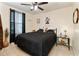 Cozy bedroom with a double bed and decorative wall art at 9979 Schroeder Aly, Winter Garden, FL 34787