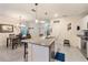 Modern kitchen with granite island, stainless steel appliances, and white cabinets at 9979 Schroeder Aly, Winter Garden, FL 34787