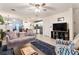 Bright living room with open floor plan, showing kitchen and dining area at 9979 Schroeder Aly, Winter Garden, FL 34787