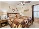Main bedroom with a king-size bed and a rustic, cabin-themed decor at 9979 Schroeder Aly, Winter Garden, FL 34787