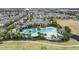 Community pool with surrounding lounge chairs and landscaping at 9979 Schroeder Aly, Winter Garden, FL 34787