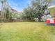 Large backyard with grassy lawn and wooden fence at 1018 Bear Lake Rd, Apopka, FL 32703