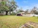 Spacious backyard with home view and large tree at 1018 Bear Lake Rd, Apopka, FL 32703