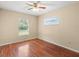 Light and airy bedroom with wood flooring and a ceiling fan at 1018 Bear Lake Rd, Apopka, FL 32703