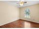 Spacious bedroom featuring wood flooring and a window with blinds at 1018 Bear Lake Rd, Apopka, FL 32703