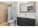 Bathroom with single vanity, shower, and toilet at 1030 Bel Aire Dr, Daytona Beach, FL 32118