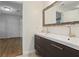 Bathroom with double vanity, modern faucets, and a large mirror at 1030 Bel Aire Dr, Daytona Beach, FL 32118