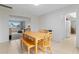 Cozy dining area with a wooden table and chairs, adjacent to the kitchen at 1030 Bel Aire Dr, Daytona Beach, FL 32118