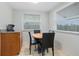 Small dining nook with a round wooden table and four black chairs at 1030 Bel Aire Dr, Daytona Beach, FL 32118