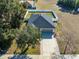 Aerial view of house with driveway and yard at 108 Alexandria Cir, Deland, FL 32724