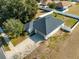 Aerial view of a house with a driveway and fenced yard at 108 Alexandria Cir, Deland, FL 32724