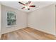 Simple bedroom with wood flooring and a window at 108 Alexandria Cir, Deland, FL 32724