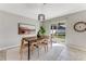 Dining room with wooden table, chairs, and access to backyard at 108 Alexandria Cir, Deland, FL 32724