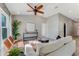 Living room with light gray sofa and large window at 108 Alexandria Cir, Deland, FL 32724