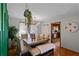 Charming dining room with a rustic wooden table and kitchen views at 117 Temple St, Deland, FL 32720