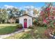 Charming guest house with red door and landscaping at 117 Temple St, Deland, FL 32720