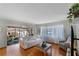 Living room with hardwood floors, access to a screened porch at 117 Temple St, Deland, FL 32720