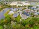 Community overview with lake and houses at 14020 Bradbury Rd, Orlando, FL 32828