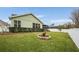 Landscaped backyard with grassy lawn and privacy fence at 14020 Bradbury Rd, Orlando, FL 32828