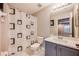 Small bathroom with grey vanity, shower, and geometric shower curtain at 14020 Bradbury Rd, Orlando, FL 32828