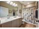 Clean bathroom with shower/tub combo and a nautical-themed shower curtain at 14020 Bradbury Rd, Orlando, FL 32828