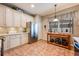 Kitchen with white cabinets, stainless steel appliances, and island at 14020 Bradbury Rd, Orlando, FL 32828