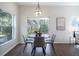 Charming dining room with round table and four chairs at 14217 Sapphire Bay Cir, Orlando, FL 32828