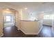 Bright hallway with dark hardwood floors and archway at 14217 Sapphire Bay Cir, Orlando, FL 32828