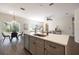 Kitchen island with white countertop and gray cabinets at 14217 Sapphire Bay Cir, Orlando, FL 32828