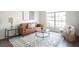 Living room with brown leather couch and patterned rug at 14217 Sapphire Bay Cir, Orlando, FL 32828