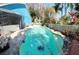 Inviting kidney-shaped swimming pool in backyard at 154 Woodbury Pines Cir, Orlando, FL 32828