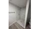 Clean bathroom featuring a marble shower and grey vinyl flooring at 1590 West Pkwy, Deland, FL 32724