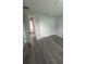 Spacious bedroom with grey vinyl flooring and large closet at 1590 West Pkwy, Deland, FL 32724