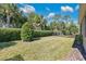 Landscaped backyard with lush greenery and fence at 161 Old Moss Cir, Deland, FL 32724