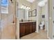 Clean bathroom with a shower and tub combo, double vanity and granite countertop at 161 Old Moss Cir, Deland, FL 32724