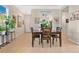 Bright dining area with wooden table and chairs near entryway at 161 Old Moss Cir, Deland, FL 32724